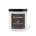 Candle with 'themelthouse' branding and 'Blushed Berry' label on a white background