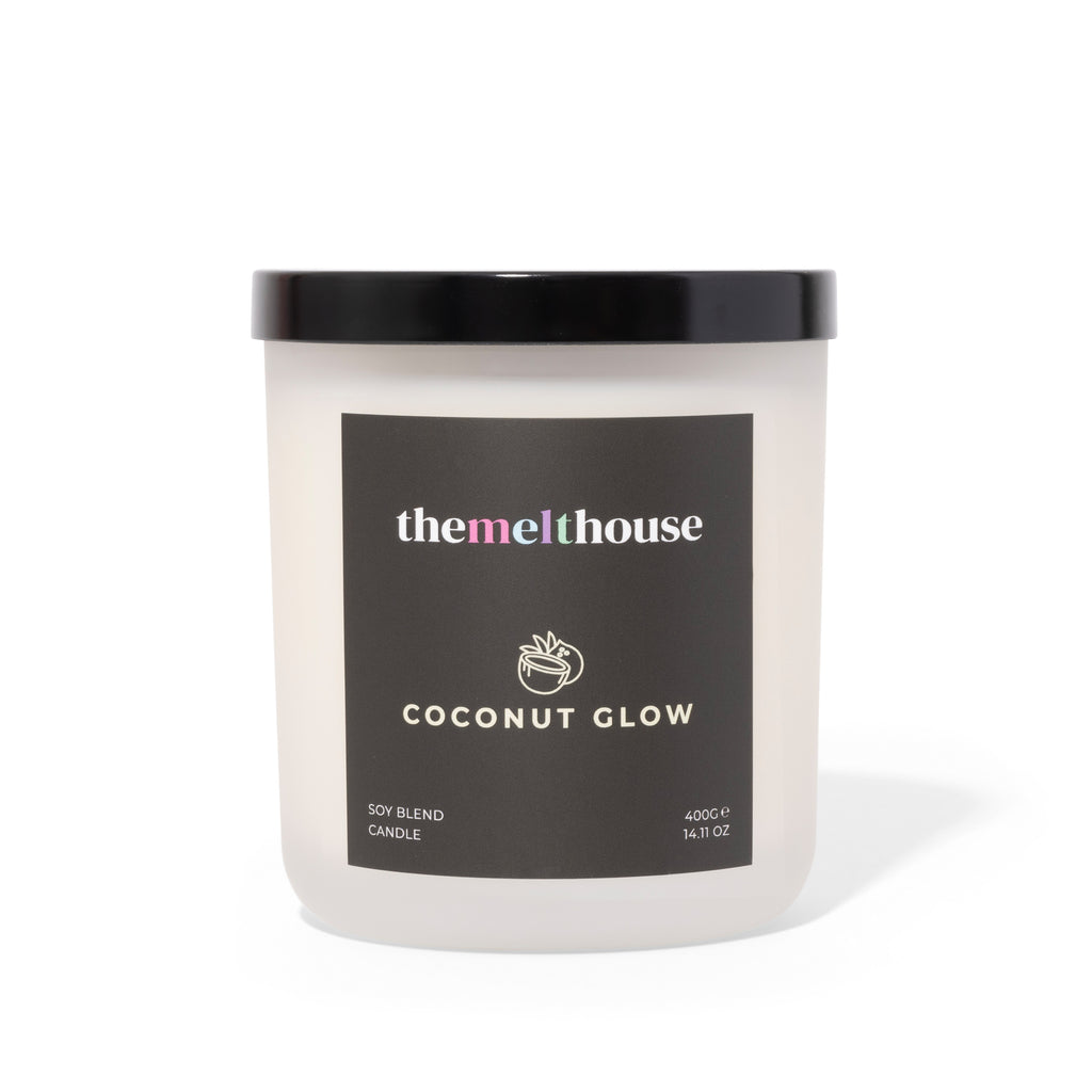 Candle with 'themelthouse' label on a white background