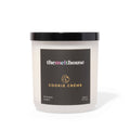 Candle with 'themelthouse' branding and 'Cookie Crème' flavor on a white background