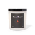 Candle with 'themelthouse' label on a white background