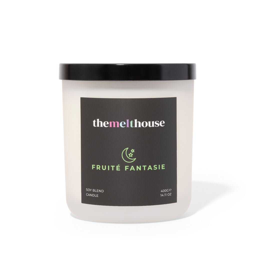 Candle with 'themelthouse' label on a white background