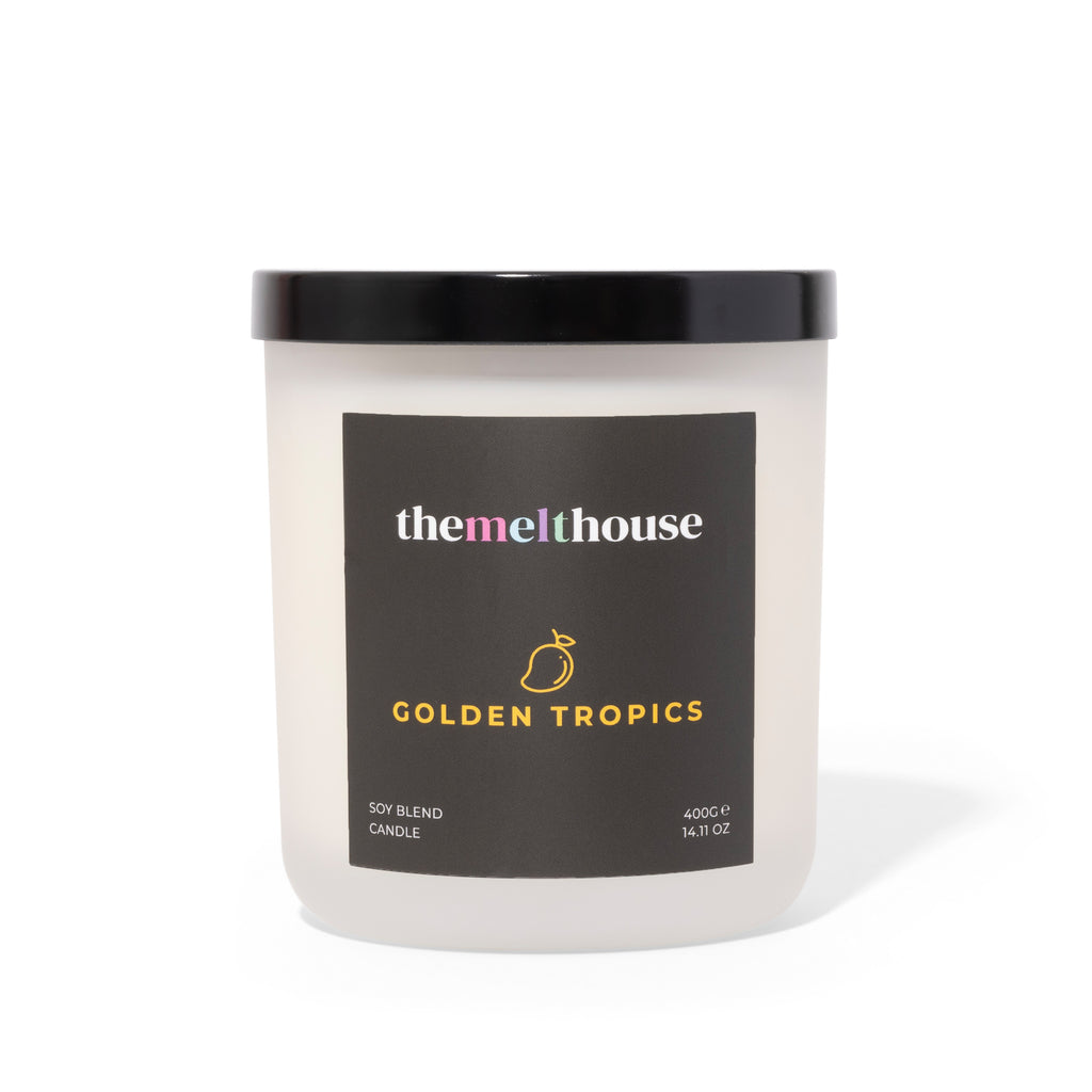 Candle with 'themelthouse' label on a white background
