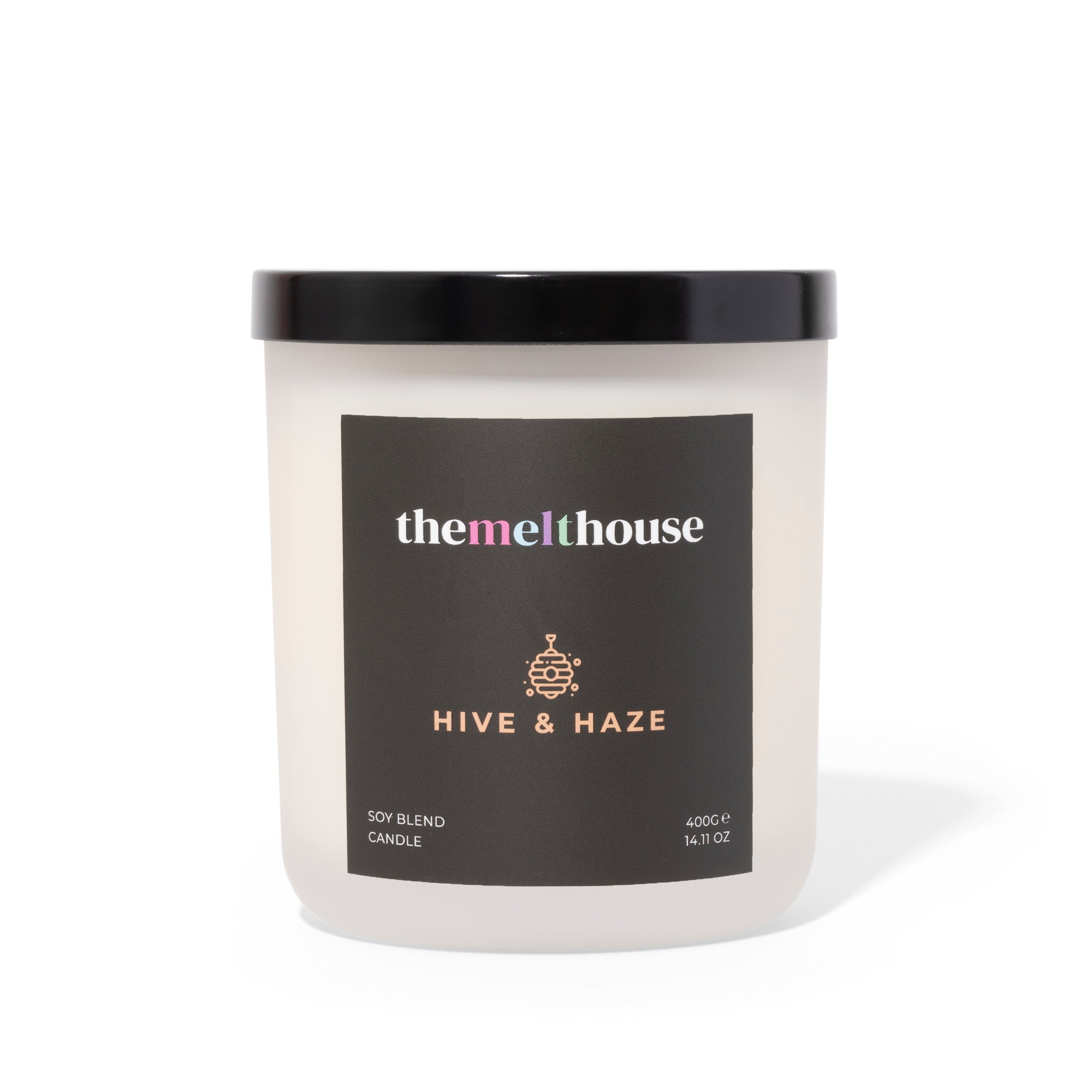 Candle with 'themelthouse' label and 'Hive & Haze' description on a white background