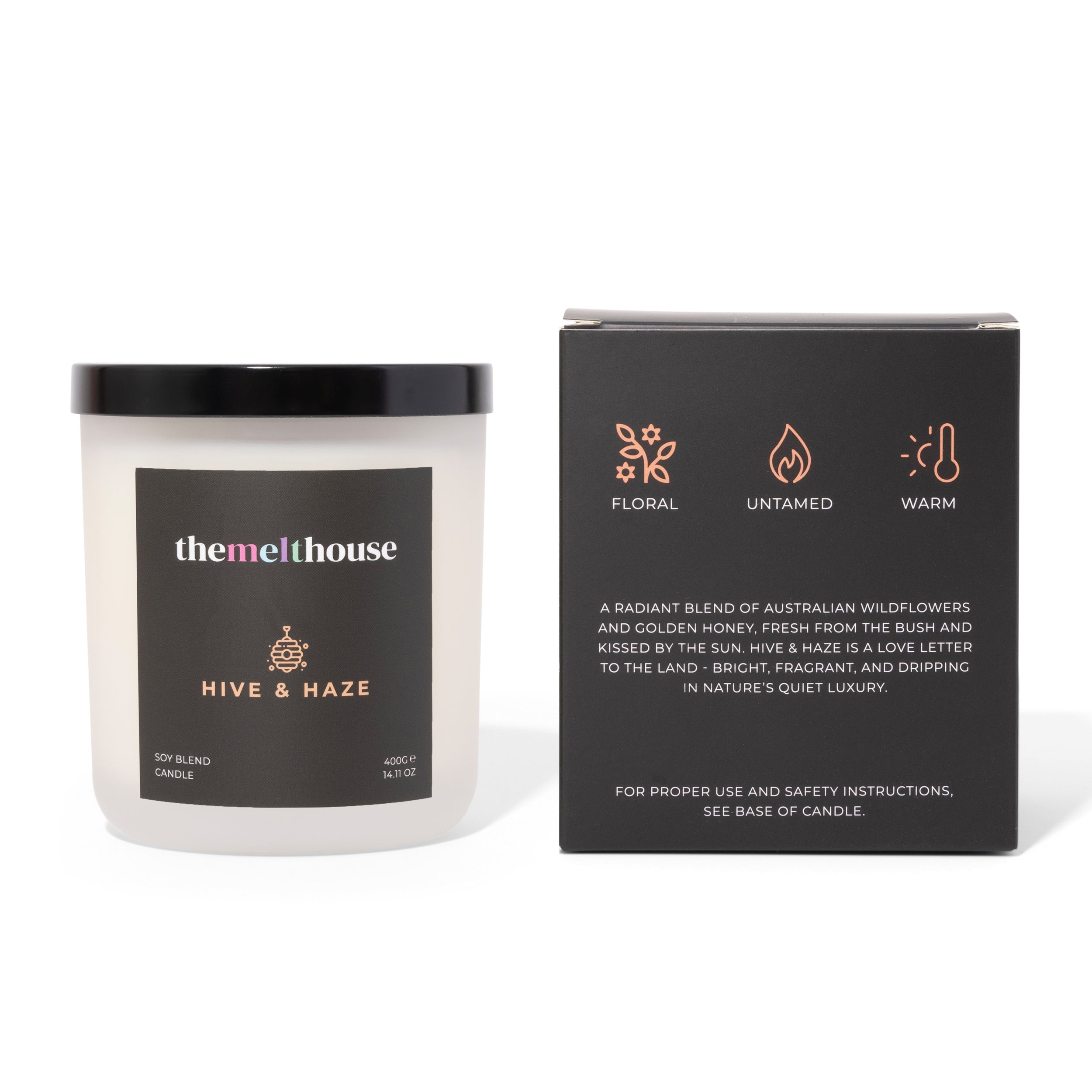 Candle labeled 'themelthouse' with packaging on a white background
