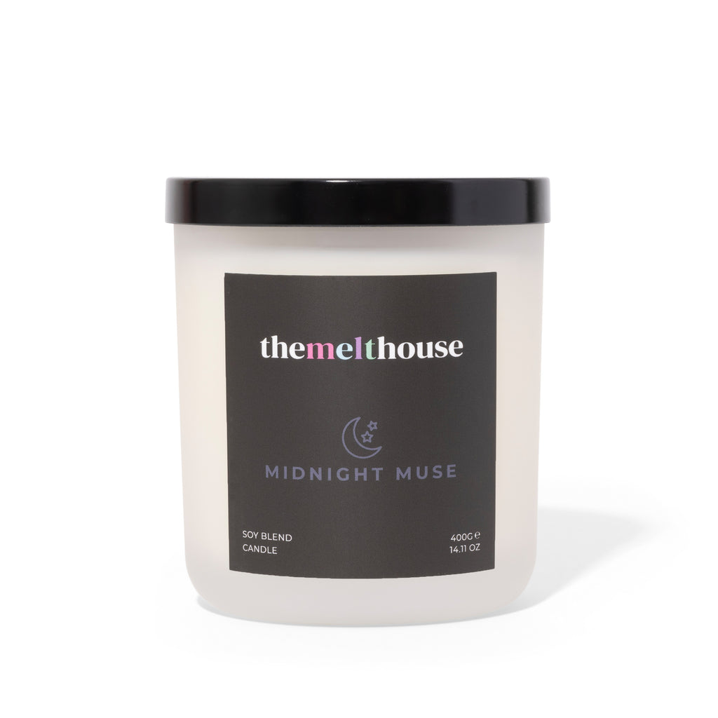 Candle with 'themelthouse' label on a white background