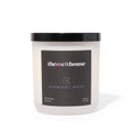 Candle with 'themelthouse' label on a white background