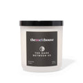 Candle with 'themelthouse' label on a white background