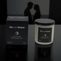 The Dark Between Us The Melthouse candle and packaging with a romantic silhouette in the background