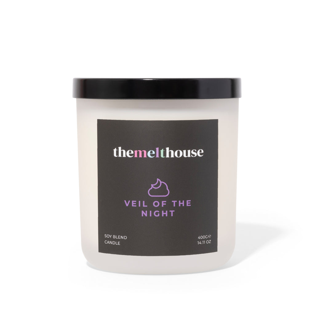 Candle with 'themelthouse' label on a white background