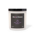 Candle with 'themelthouse' label on a white background
