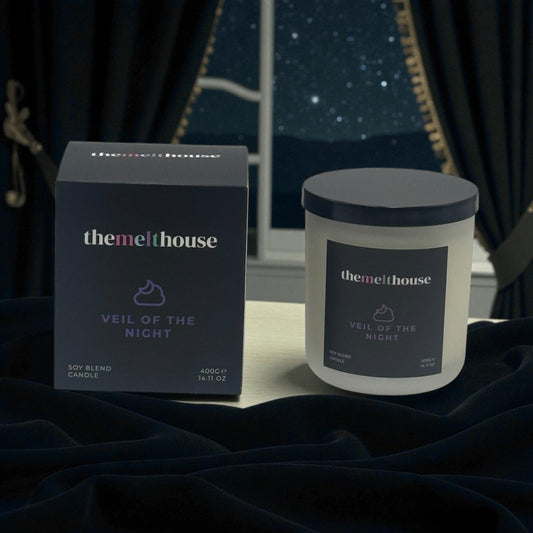 The Melthouse candle and packaging on a dark background