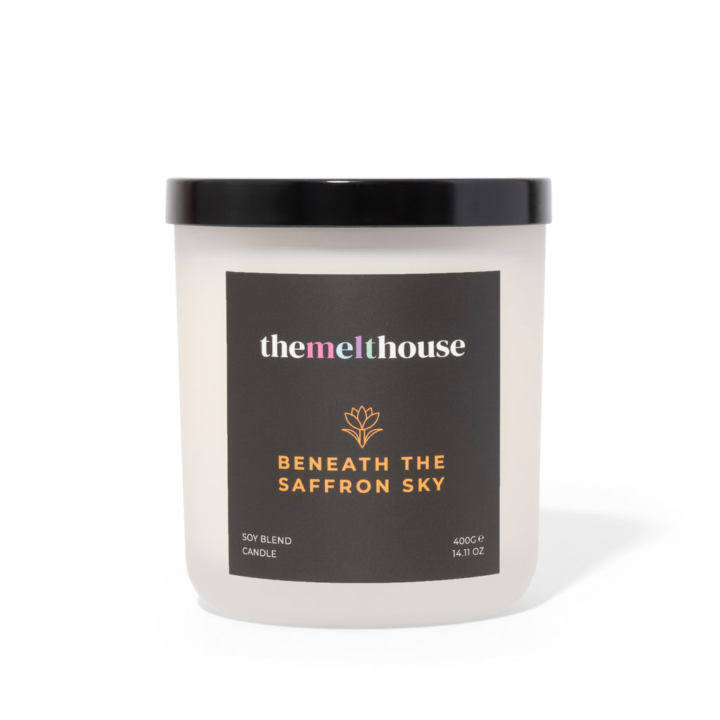 Candle with 'themelthouse' label on a white background