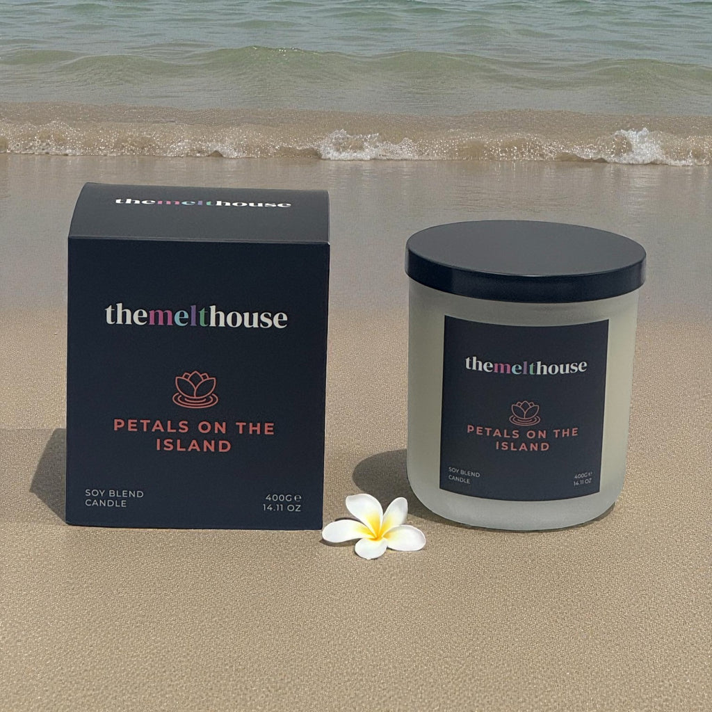 Petals on the Island Candle with soft frangipani floral scent in a  bottle