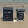 Petals on the Island Candle with soft frangipani floral scent in a  bottle